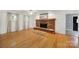 Hardwood floors and fireplace in a sunny living room create an inviting atmosphere at 9143 Sadlers Ridge Rd, Fort Mill, SC 29707