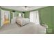 Bright and airy main bedroom with neutral carpet and sliding glass doors to a private patio at 9143 Sadlers Ridge Rd, Fort Mill, SC 29707