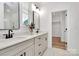 Modern bathroom featuring double vanity, sleek fixtures, and bright natural light at 3230 Rogers St, Charlotte, NC 28208