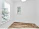 Bright bedroom with large windows, wood-look flooring, and ample natural light at 3230 Rogers St, Charlotte, NC 28208