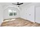 Bedroom with hardwood floors, a window, and a ceiling fan at 3230 Rogers St, Charlotte, NC 28208