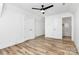 Spacious bedroom with wood floors and two doors, one leading to the bathroom at 3230 Rogers St, Charlotte, NC 28208