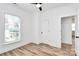 Comfortable bedroom with neutral colors, wood-look flooring, and natural light at 3230 Rogers St, Charlotte, NC 28208