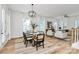 Bright dining room with modern light fixture, stylish table, and open floor plan at 3230 Rogers St, Charlotte, NC 28208