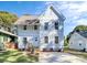 Inviting two-story home showcasing bright siding, manicured lawn, and a welcoming entrance, all under a clear sky at 3230 Rogers St, Charlotte, NC 28208
