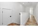 Hallway with wooden floors and white trim at 3230 Rogers St, Charlotte, NC 28208