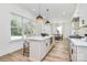 Spacious kitchen with center island, pendant lighting, stainless appliances and ample natural light at 3230 Rogers St, Charlotte, NC 28208