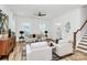 Bright living room features stylish seating, modern decor, and hardwood floors, creating a welcoming and sophisticated atmosphere at 3230 Rogers St, Charlotte, NC 28208