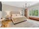 Bright bedroom with hardwood floors, large windows, and built-in shelving at 104 Hidden Cove Dr, Shelby, NC 28150