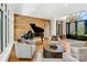 Living room features hardwood floors, a grand piano, and comfortable seating at 104 Hidden Cove Dr, Shelby, NC 28150