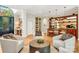 Spacious living area with a custom bar, comfortable seating, and hardwood floors at 104 Hidden Cove Dr, Shelby, NC 28150