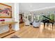 Light-filled living room features hardwood floors, a grand piano, and comfortable seating at 104 Hidden Cove Dr, Shelby, NC 28150