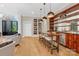 Home bar with wooden countertops, shelving and stylish pendant lighting at 104 Hidden Cove Dr, Shelby, NC 28150