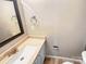 Bathroom featuring a sink, mirror, and neutral wall color at 6003 Heath Valley Rd, Charlotte, NC 28210