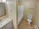 Bathroom featuring a tiled shower/tub combo and toilet at 6003 Heath Valley Rd, Charlotte, NC 28210