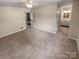 Spacious carpeted bedroom with a ceiling fan at 6003 Heath Valley Rd, Charlotte, NC 28210