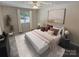 Bedroom features a large bed, window view and decor at 6003 Heath Valley Rd, Charlotte, NC 28210