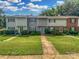 Charming two-story townhome featuring a well-maintained lawn and quaint facade at 6003 Heath Valley Rd, Charlotte, NC 28210