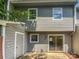 Back exterior features siding, sliding glass door, and small patio at 6003 Heath Valley Rd, Charlotte, NC 28210