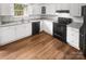 Well-lit kitchen showcasing white cabinetry, modern appliances, and granite countertops at 6003 Heath Valley Rd, Charlotte, NC 28210