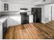 Efficient kitchen features white cabinets, black appliances, and stylish countertops at 6003 Heath Valley Rd, Charlotte, NC 28210