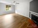 Bright living room with fireplace and large window providing ample natural light at 6003 Heath Valley Rd, Charlotte, NC 28210