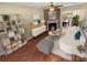 Stylishly staged living room with fireplace, modern furniture, and hardwood flooring at 6003 Heath Valley Rd, Charlotte, NC 28210