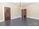 Bright bedroom with hardwood floors and ornate wood door at 903 W Franklin St, Monroe, NC 28112