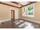 Bright dining room with hardwood floors, chandelier, and stained glass windows at 903 W Franklin St, Monroe, NC 28112