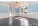 Light-filled dining area with hardwood floors and French doors at 903 W Franklin St, Monroe, NC 28112