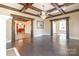Elegant dining room features hardwood floors, a chandelier, and decorative ceiling beams at 903 W Franklin St, Monroe, NC 28112