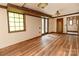 Elegant dining room with hardwood floors and stained glass window at 903 W Franklin St, Monroe, NC 28112