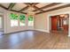 Bright dining room with stained glass windows, hardwood floors, and chandelier at 903 W Franklin St, Monroe, NC 28112