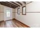 Charming entryway with wood floors and stained glass windows at 903 W Franklin St, Monroe, NC 28112
