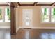 Entryway with hardwood floors, stained glass windows, and dark wood trim at 903 W Franklin St, Monroe, NC 28112
