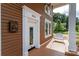 Front door entry with porch and white swing at 903 W Franklin St, Monroe, NC 28112