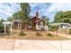 Side view of house with landscaping and pergola at 903 W Franklin St, Monroe, NC 28112
