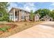 Front view of two story house with porch and landscaping at 903 W Franklin St, Monroe, NC 28112