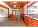 Spacious kitchen boasts island, wood cabinets, and a charming window at 903 W Franklin St, Monroe, NC 28112