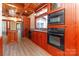 Renovated kitchen with dark wood cabinets and modern appliances at 903 W Franklin St, Monroe, NC 28112