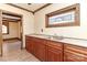 Small kitchen with wood cabinets and a stainless steel sink at 903 W Franklin St, Monroe, NC 28112