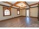 Bright living room with hardwood floors, stained glass windows and chandelier at 903 W Franklin St, Monroe, NC 28112