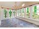 Sunroom with slate floor, stained glass, and lots of light at 903 W Franklin St, Monroe, NC 28112