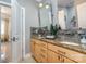 Bathroom with double sinks, granite countertops, and a tile backsplash at 3020 Poplar Hill Rd, Charlotte, NC 28270
