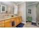 Beautiful bathroom featuring double sinks, granite counters, and a glass door shower at 3020 Poplar Hill Rd, Charlotte, NC 28270