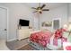 Neutral bedroom with hardwood floors, a ceiling fan, and a large window at 3020 Poplar Hill Rd, Charlotte, NC 28270