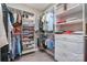 Organized closet with shelving and drawers for storing clothes and accessories at 3020 Poplar Hill Rd, Charlotte, NC 28270