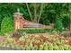 Brick sign and well-maintained landscaping at the entrance of Providence Plantation community at 3020 Poplar Hill Rd, Charlotte, NC 28270