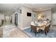 Formal dining area featuring a marble table, modern chairs, and elegant decor at 3020 Poplar Hill Rd, Charlotte, NC 28270