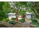 Home with a spacious driveway, large garage and beautiful landscaping at 3020 Poplar Hill Rd, Charlotte, NC 28270